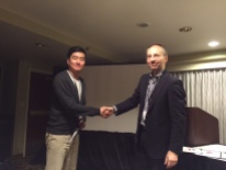 Joseph Yoo from The University of Texas at Austin receives his top student paper award from Axel Roepnack, Research Chair for the 2014-2015 paper competition.