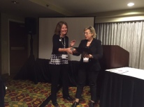 Angela Powers from Kansas State University receives the Barry Sherman Teaching Award from past head of the MMEE division, Bozena Mierzejewska.